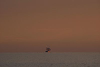 Ship sailing in baltic sea during sunset