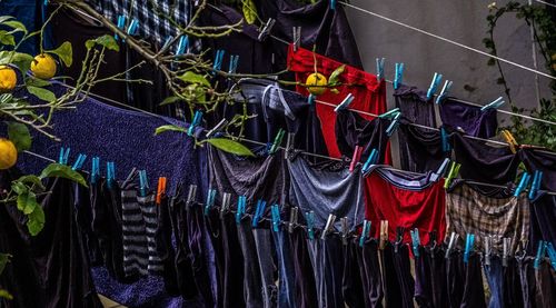 Low angle view of clothes hanging at market