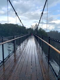 Footbridge against sky