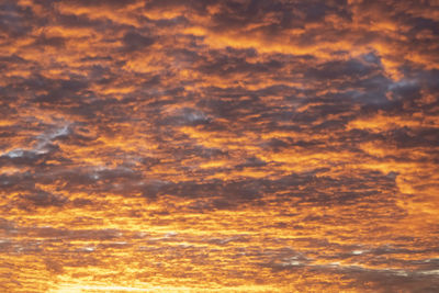 Low angle view of dramatic sky during sunset