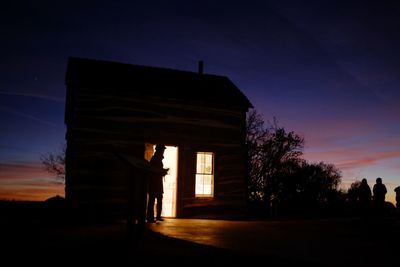 Silhouette of building at sunset