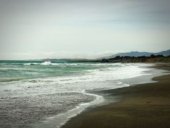 Scenic view of beach against sky