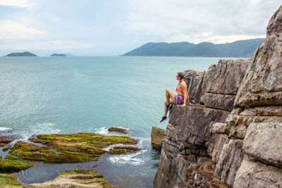 Scenic view of sea and mountains against sky