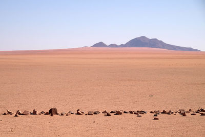 Scenic view of desert against clear sky