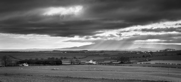 Scenic view of dramatic sky over land