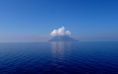 Scenic view of sea against blue sky