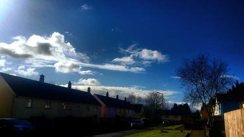 Buildings against blue sky and clouds