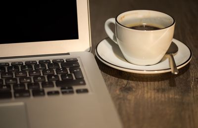 High angle view of coffee cup on table