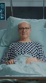 Portrait of senior man resting at hospital