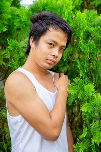 Portrait of young man standing outdoors