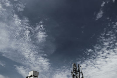 Low angle view of communications tower against sky