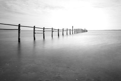 Pier over sea against sky