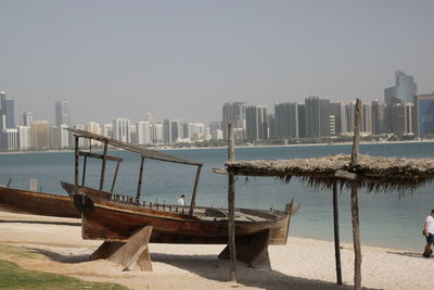 Panoramic view of sea and buildings against clear sky