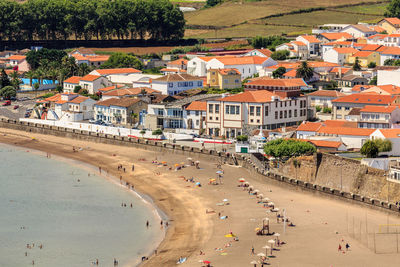 Scenic view of beach and buildings in city