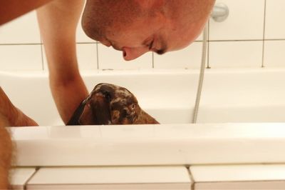 Midsection of man in bathroom