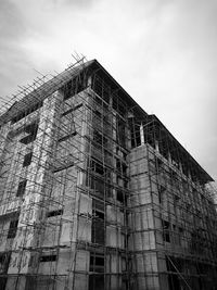 Low angle view of building construction against sky