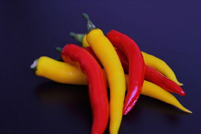 Close-up of chili peppers on table