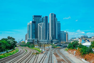 Modern buildings against blue sky in city