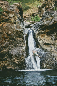 Man enjoying waterfall
