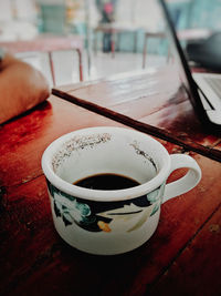 Close-up of coffee cup on table