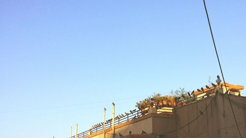 High section of built structure against blue sky