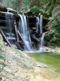 Scenic view of waterfall in forest