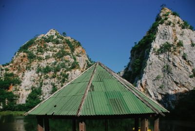 Scenic view of mountains against clear blue sky