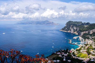 High angle view of sea and buildings against sky