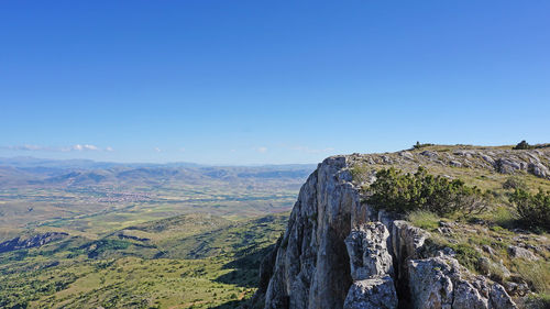 Panoramic view of landscape against clear blue sky