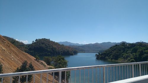 Scenic view of mountains against clear blue sky