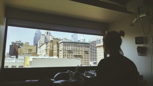 Rear view of people in office building