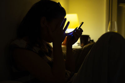 Close-up of man using mobile phone