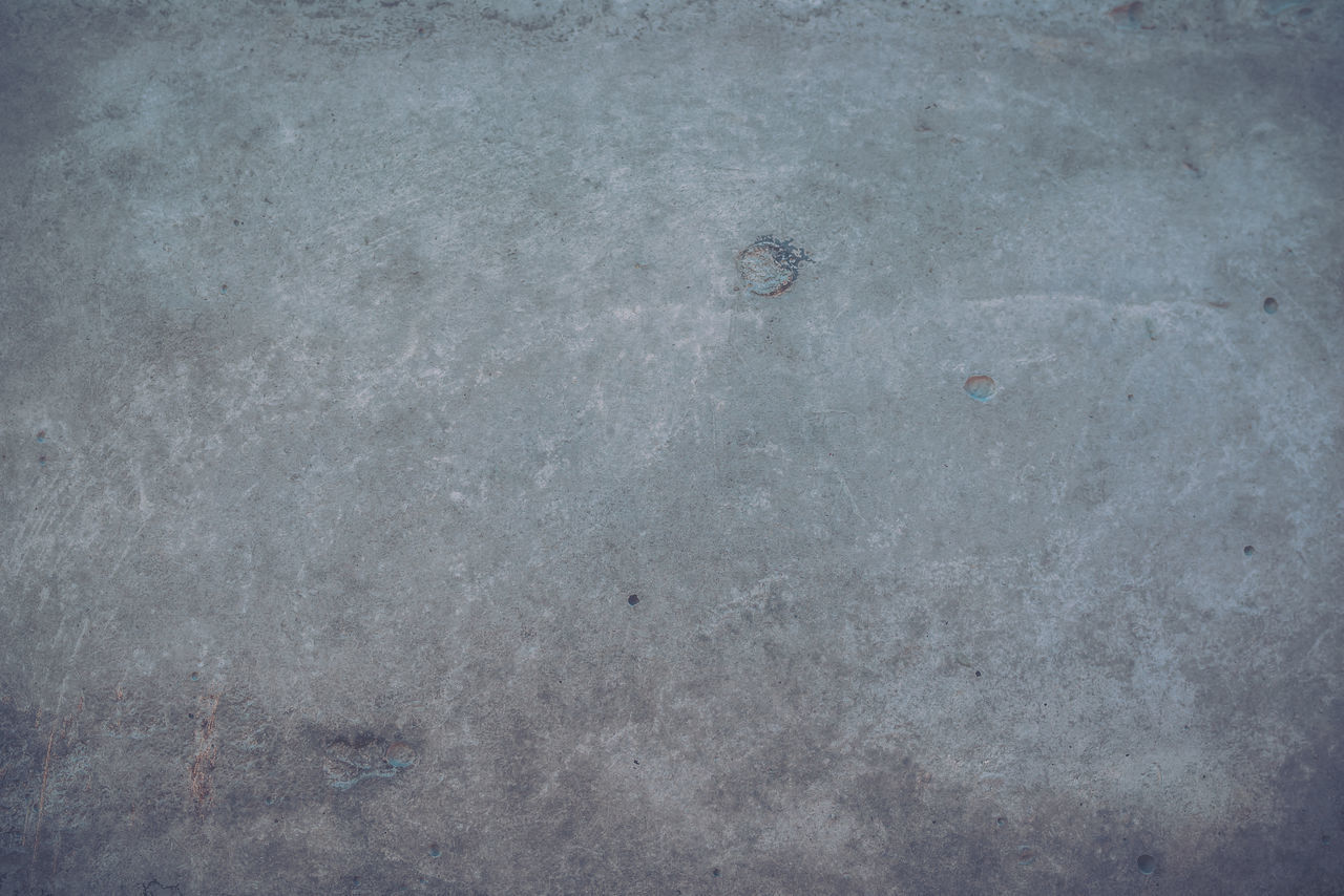 FULL FRAME SHOT OF CONCRETE WALL WITH SHADOW