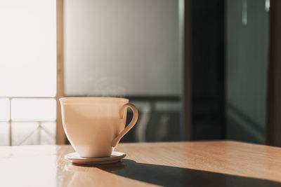 Close-up of coffee cup on table