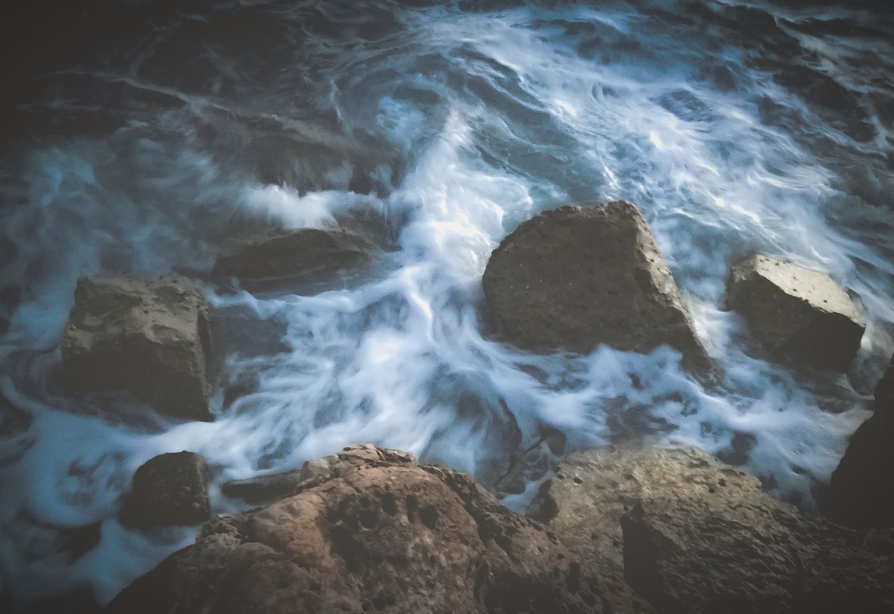 rock, water, solid, rock - object, motion, sea, no people, sport, nature, beauty in nature, land, beach, wave, long exposure, aquatic sport, blurred motion, day, outdoors, power in nature, flowing water