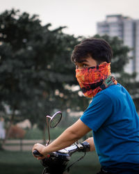 Man riding bicycle on city