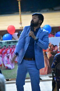 Full length of young man looking away