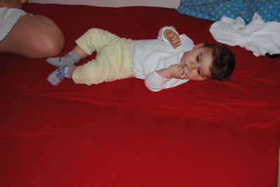 Cute boy lying on bed