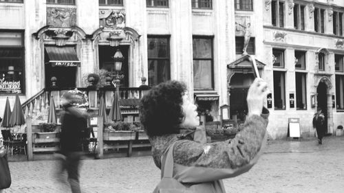 Woman standing in city