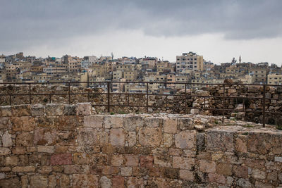 View of old building against cloudy sky