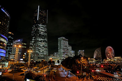 Illuminated buildings in city at night