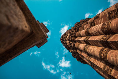 Low angle view of buildings against blue sky