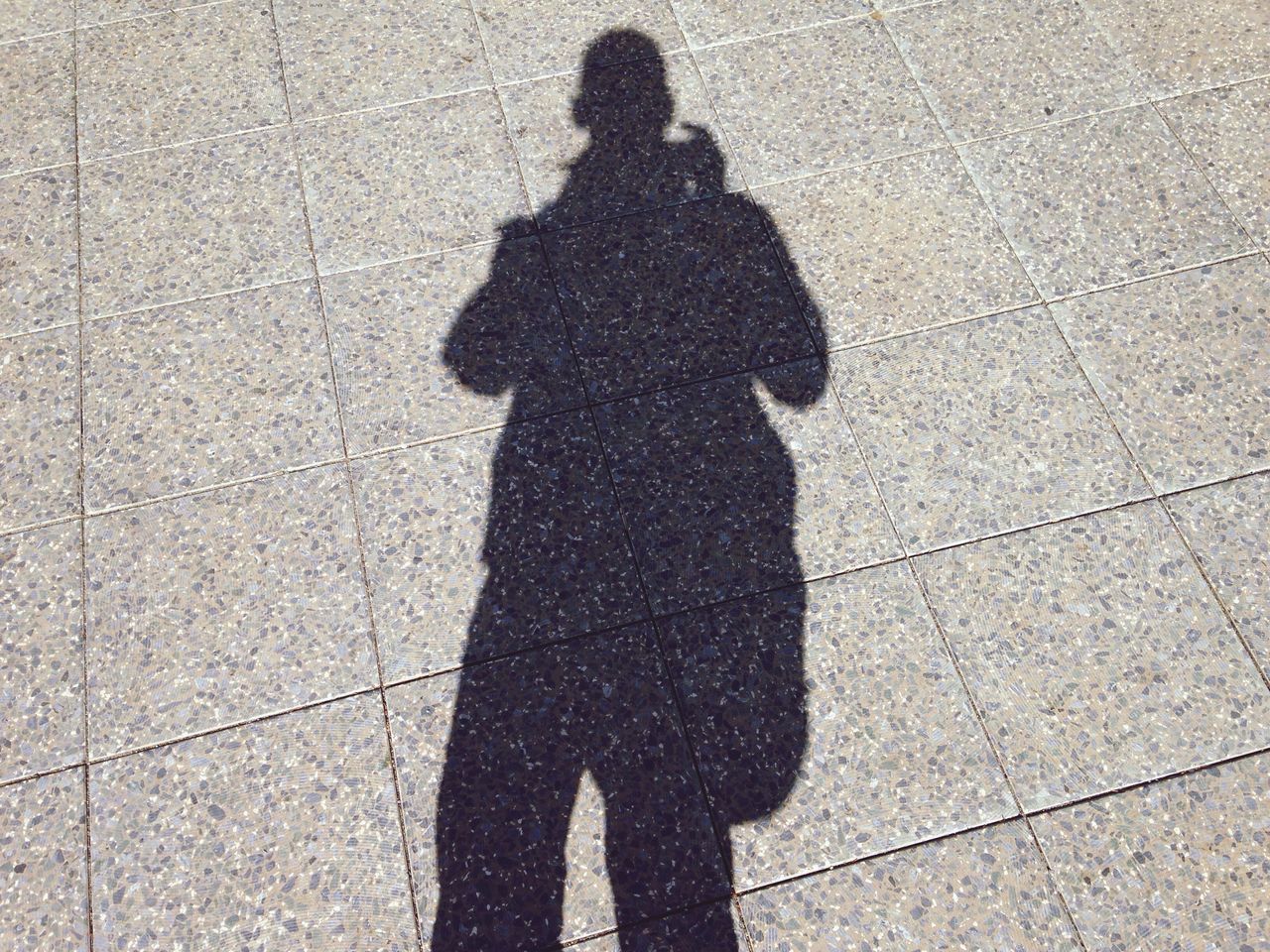 shadow, focus on shadow, sunlight, high angle view, lifestyles, street, standing, leisure activity, silhouette, men, unrecognizable person, outline, outdoors, day, road, walking, person, sidewalk