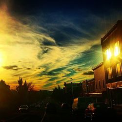 Cars on road at sunset