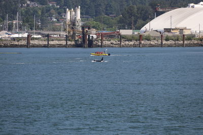 Scenic view of sea against buildings