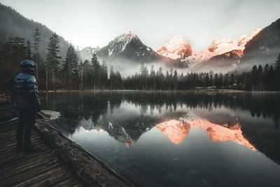 Reflection of trees in lake against sky