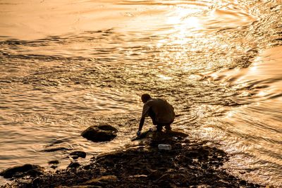 High angle view of man fishing on beach