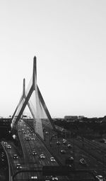 View of bridge and cityscape against clear sky