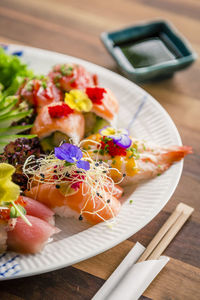 High angle view of fruits in plate on table