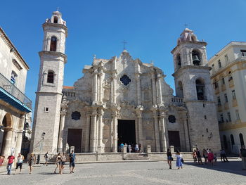 Group of people in front of a church in old havana cuba